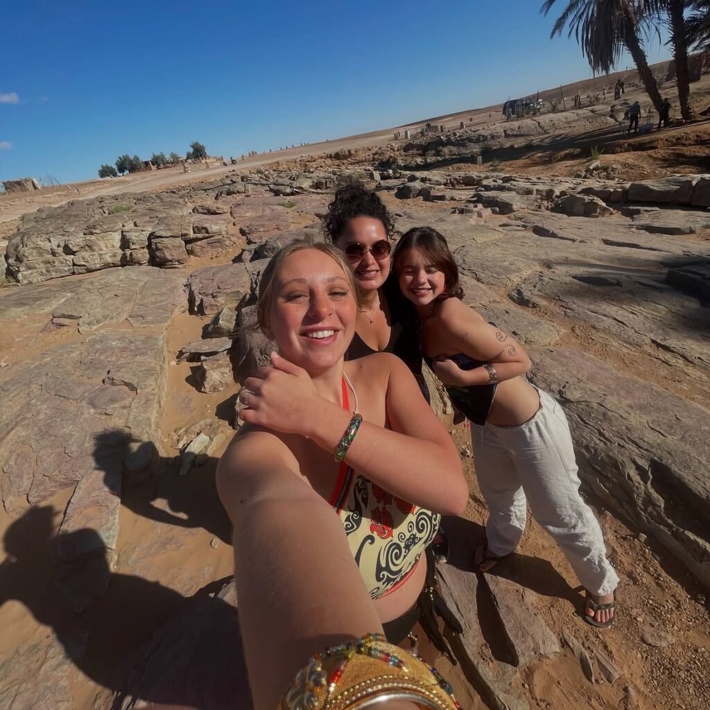 Three Serenity Sahara guests taking a selfie on a desert excursion in Morocco